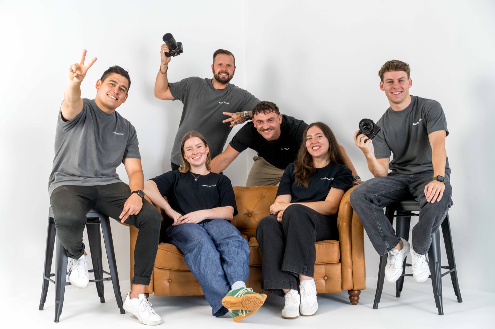 The Grab Social team, seven people in Grab Social shirts