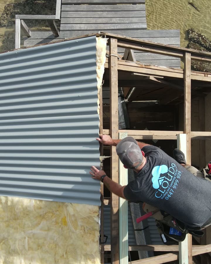 Roofer fixing cladding